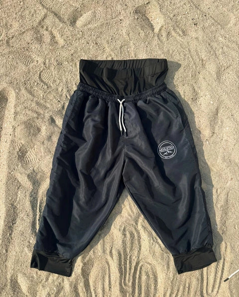 Modest swim shorts in navy blue, front view